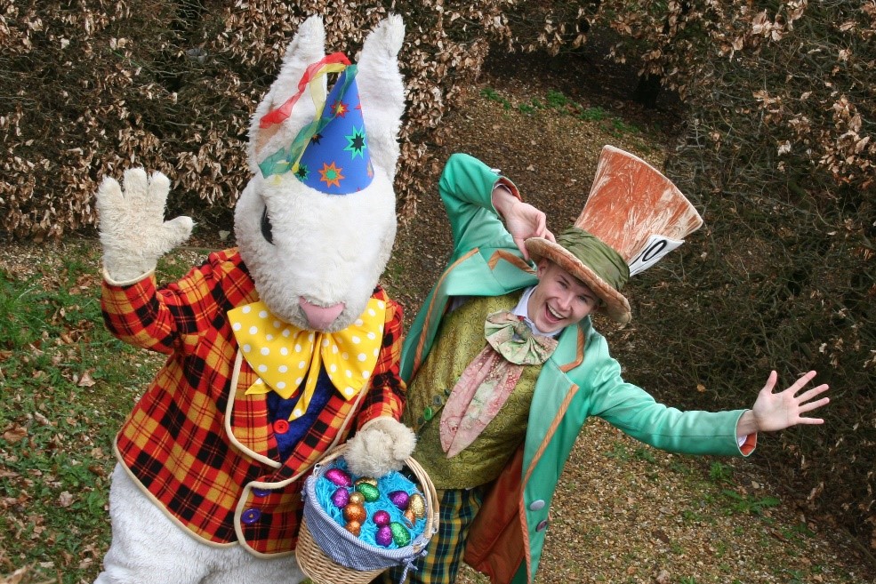 Rabbit and the mad hatter enjoying their Easter egg hut at Adventure wonderland 